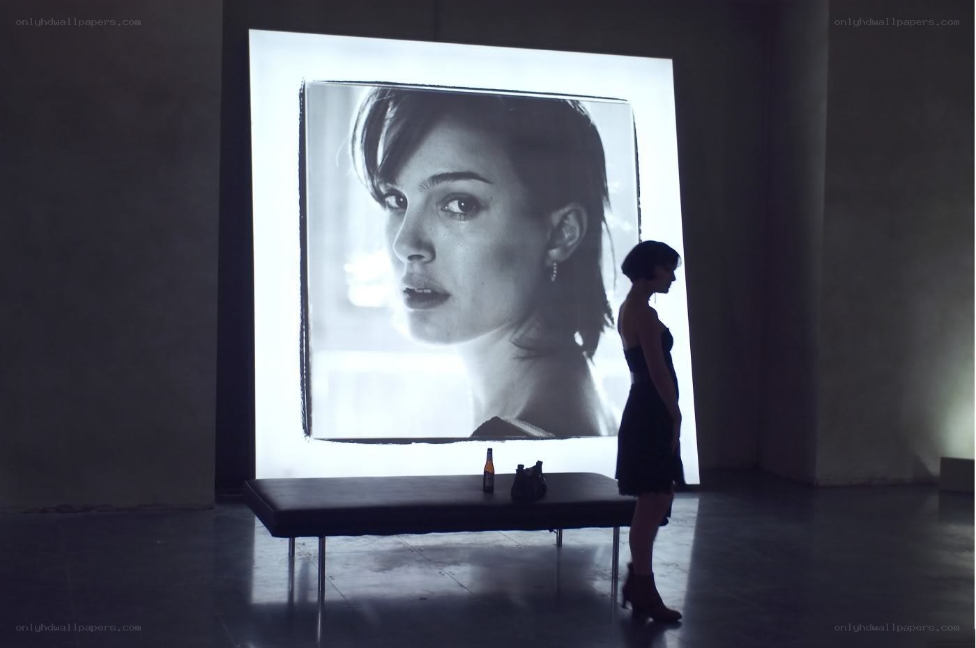 woman viewing large portrait