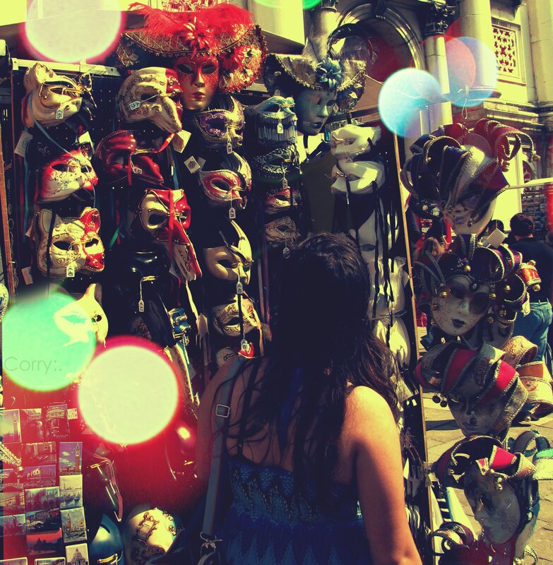 Woman viewing masks at a market