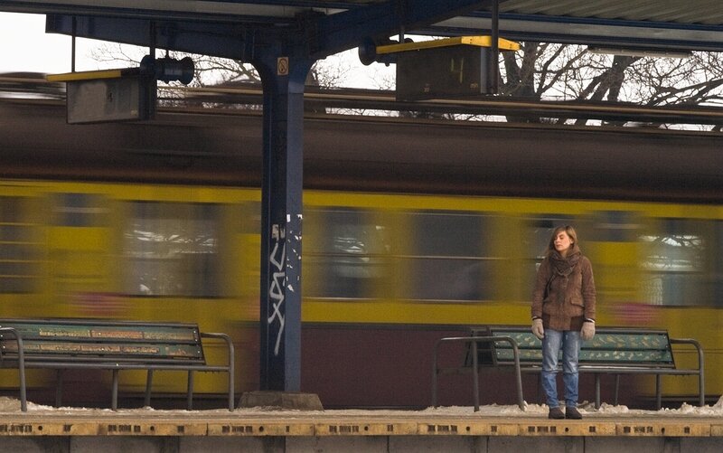 Woman waiting at train station