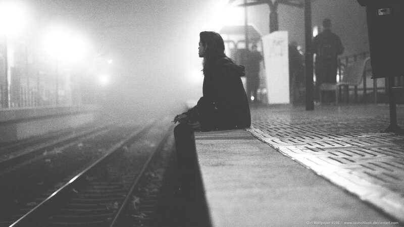 woman waiting at train station