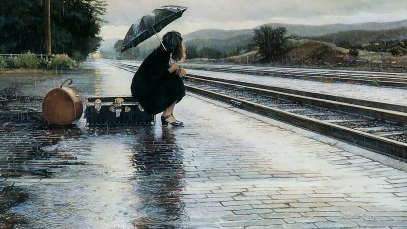 Woman waiting at train station in rain
