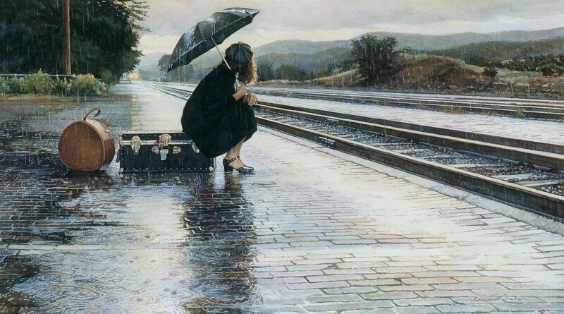 Woman waiting at train station in rain