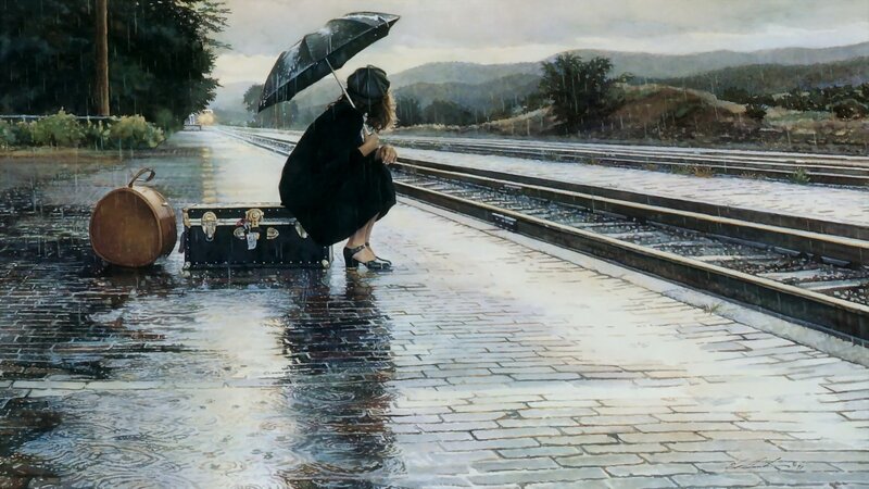Woman waiting at train station in rain