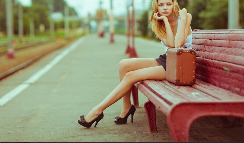 Woman waiting on a bench