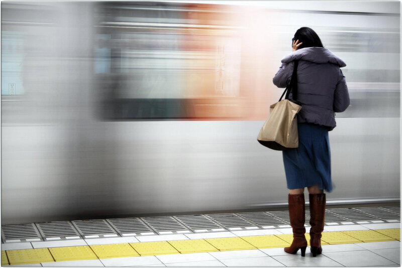 Woman Waiting on Train Platform