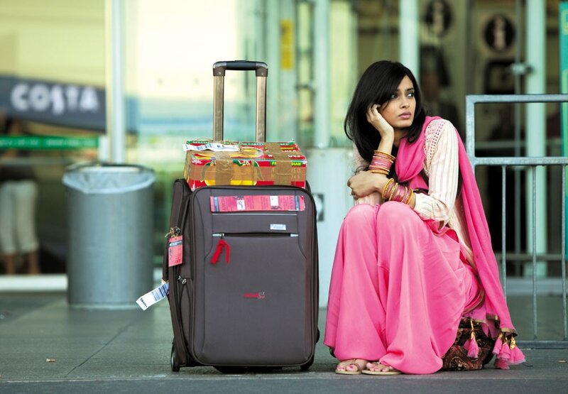Woman waiting with luggage