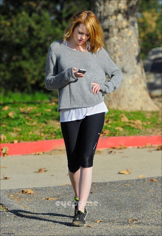 woman walking and using phone