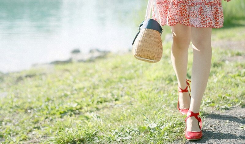 woman walking by the water