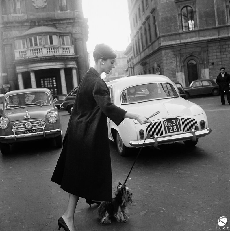 Woman walking dog in Rome