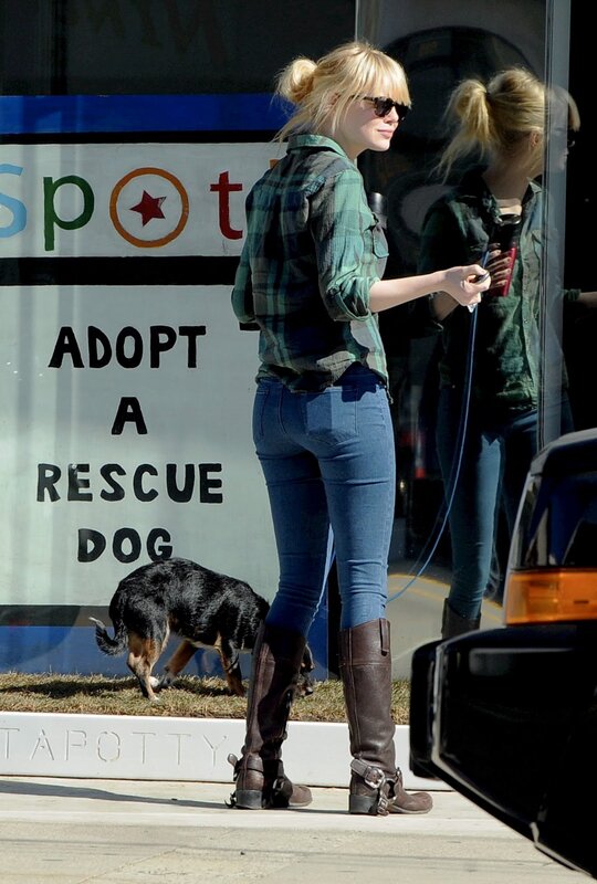 Woman walking dog outside shelter