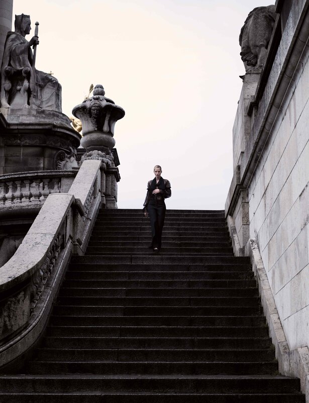woman walking down stone stairs