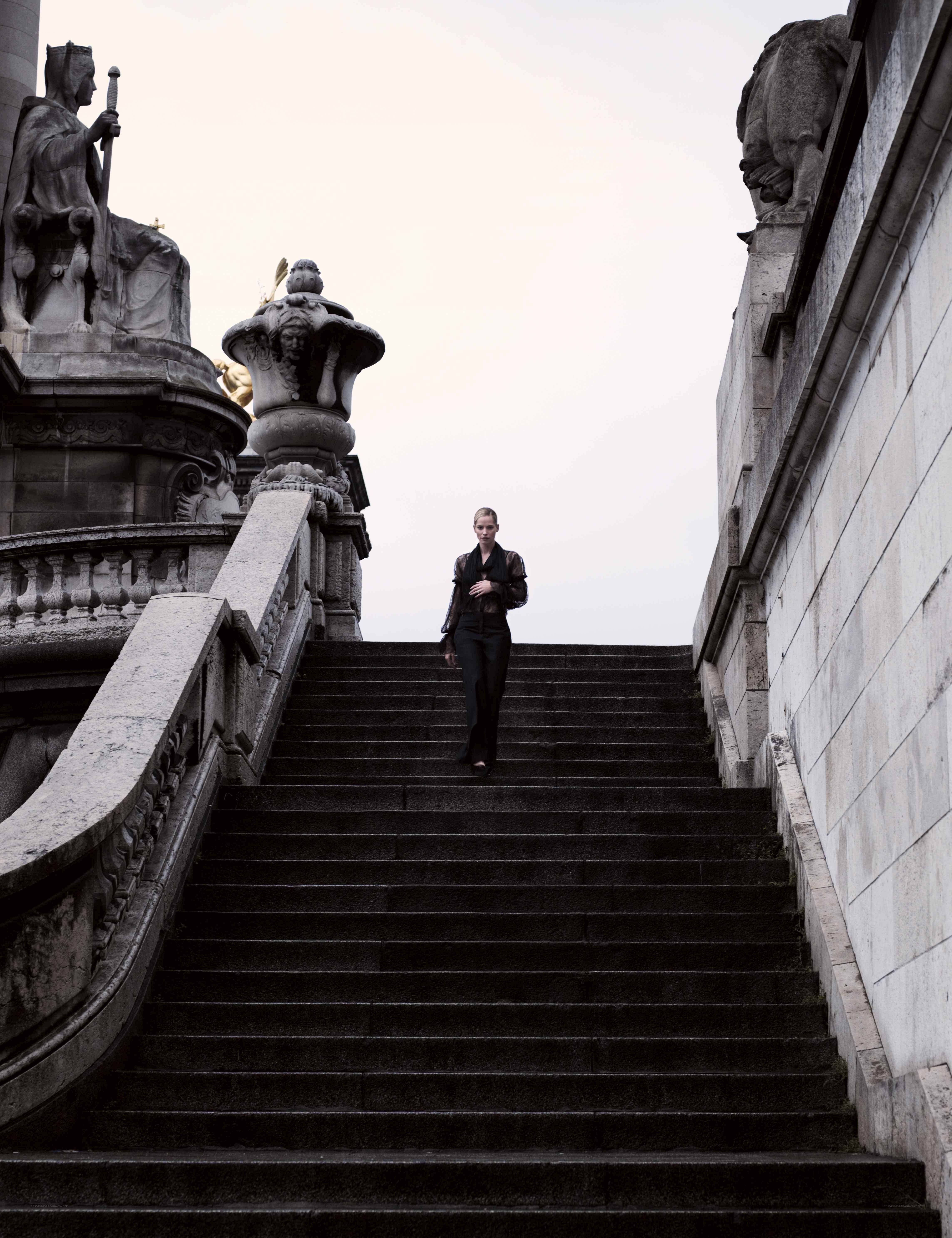 woman walking down stone stairs