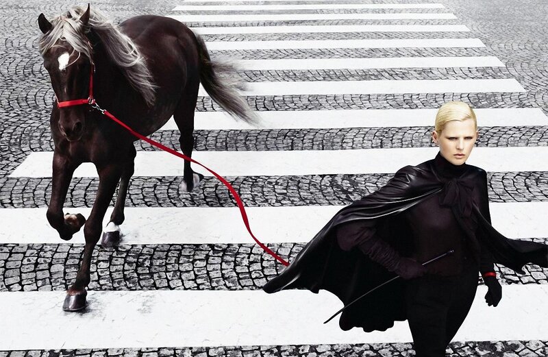 Woman walking horse on leash