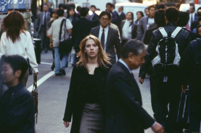 Woman walking in a crowded street