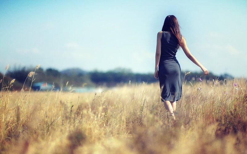 Woman walking in a field