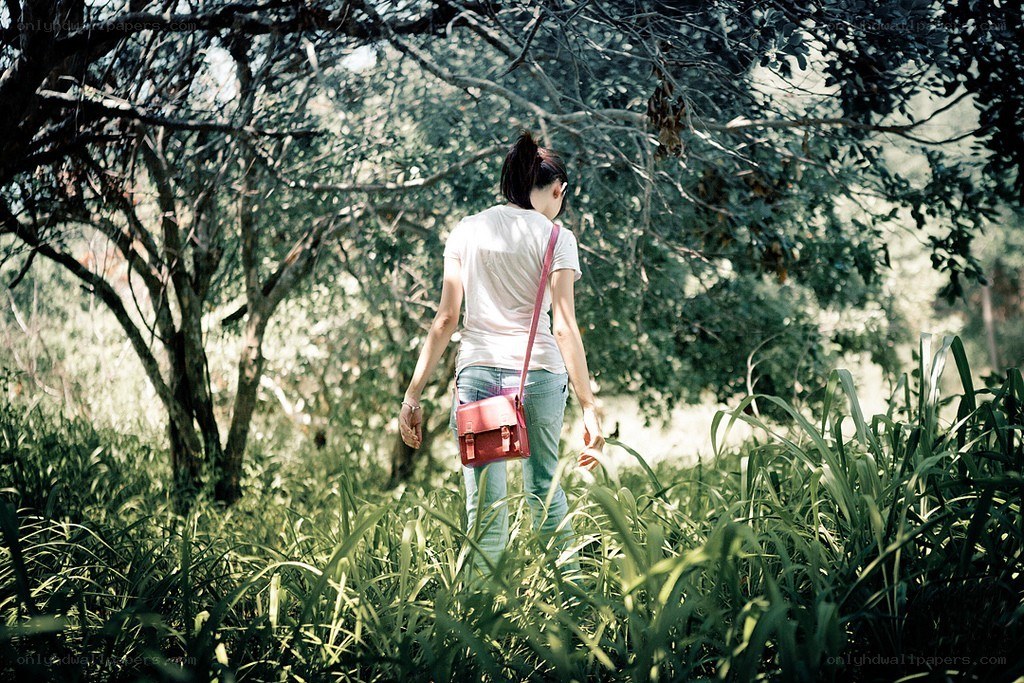 Woman walking in a forest