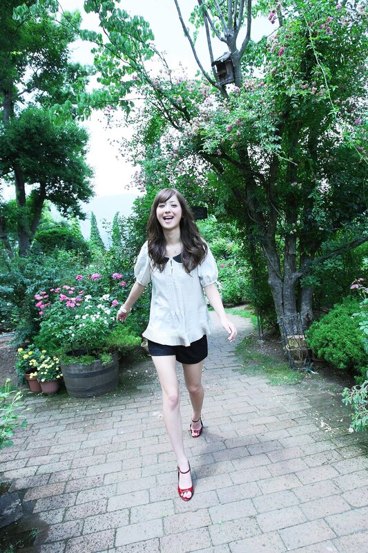 Woman walking in a garden
