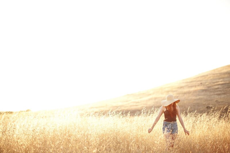 Woman walking in a golden field