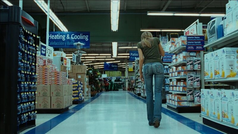 Woman walking in a store aisle