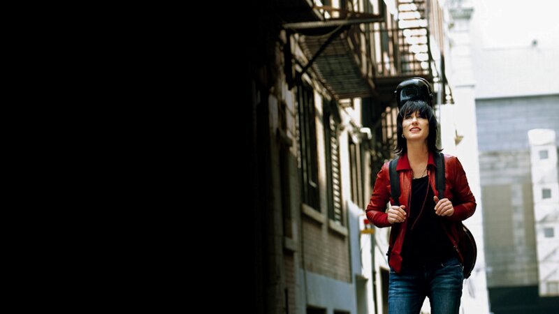 woman walking in alleyway