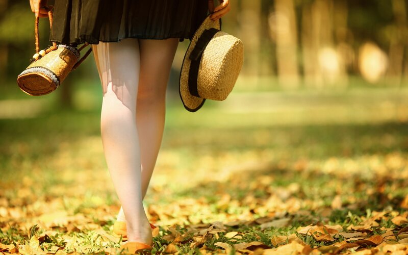 woman walking in autumn park