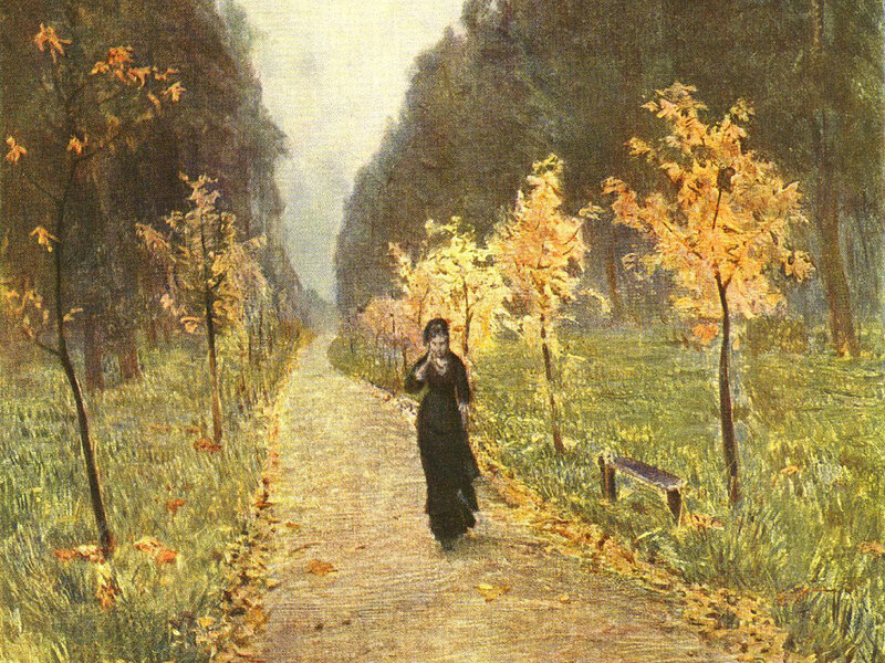 Woman walking in autumn park