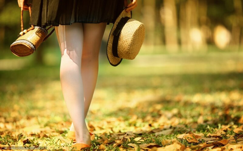 Woman walking in autumn park