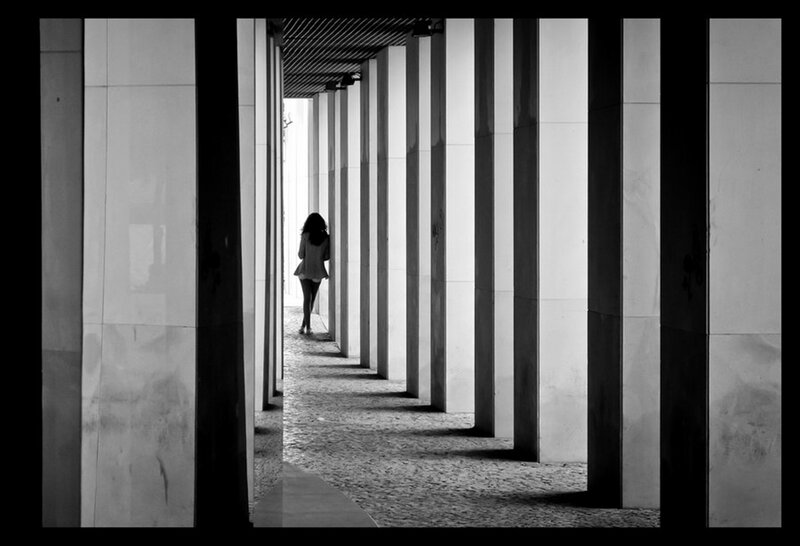 Woman Walking in Corridor