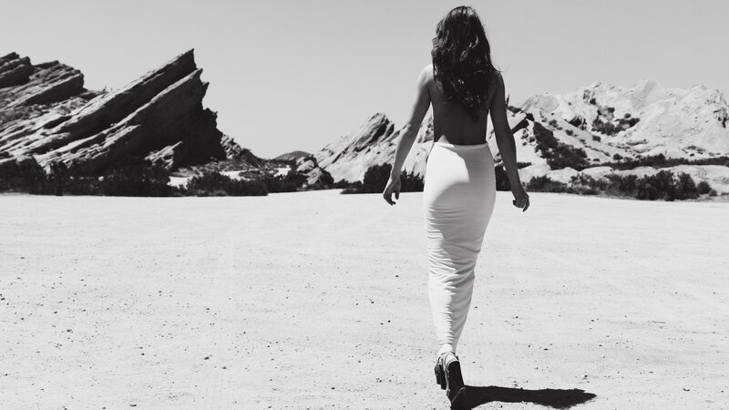 woman walking in desert