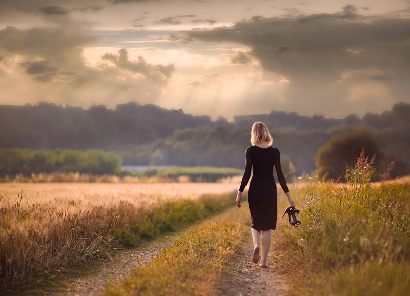 Woman Walking in Field — Gold, Dramatic