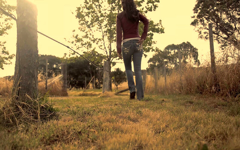 Woman Walking in Field — Yellow, Serene, Sunset