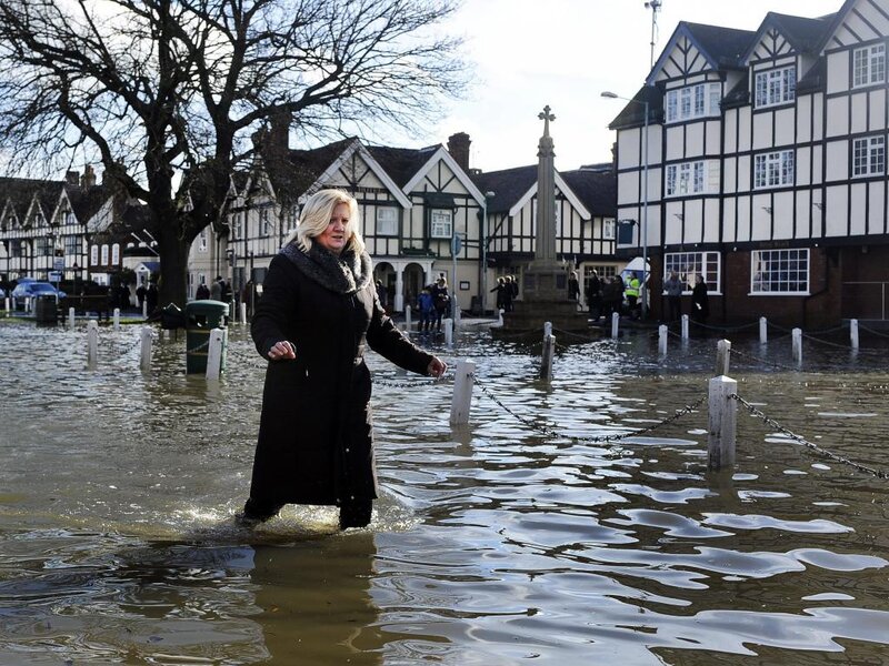 Woman Walking in Flood