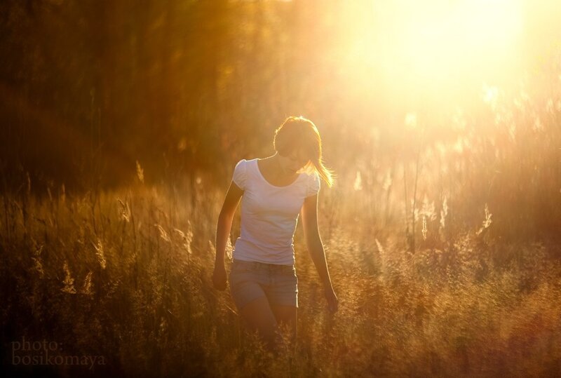 woman walking in golden field