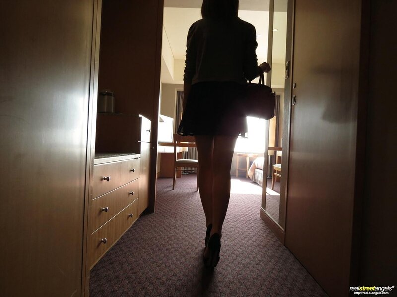 Woman walking in hotel room