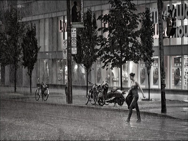 Woman Walking in Rain — Black, Dramatic
