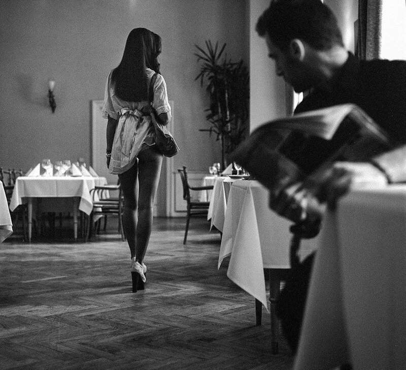 Woman Walking in Restaurant