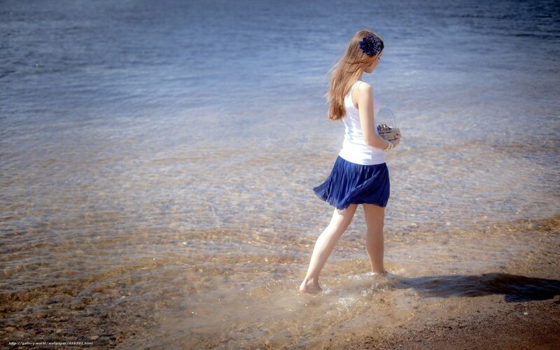 woman walking in shallow water