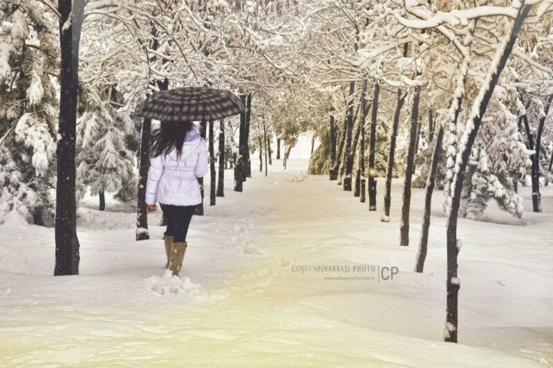 Woman Walking in Snow — White