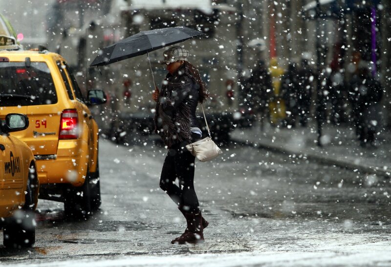 Woman walking in snowstorm