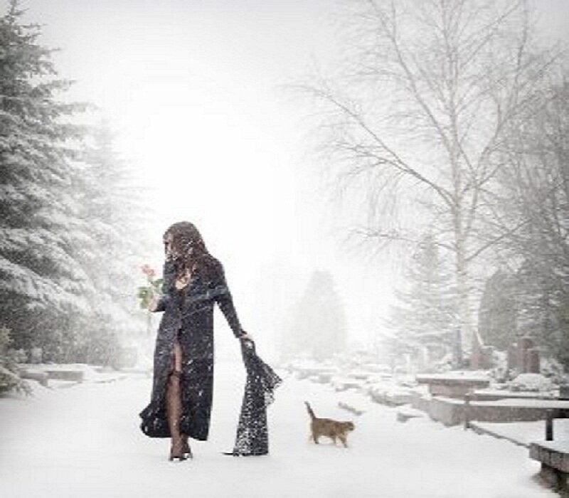 Woman walking in snowy park