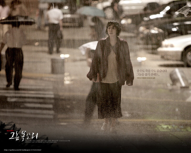 woman walking in the rain