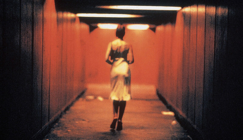 woman walking in tunnel