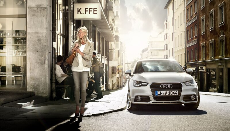 Woman walking near Audi car