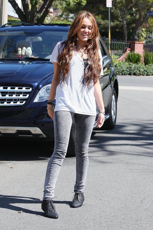 woman walking near car