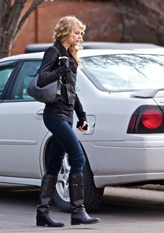 woman walking near car