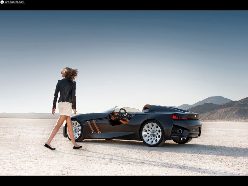 woman walking near concept car