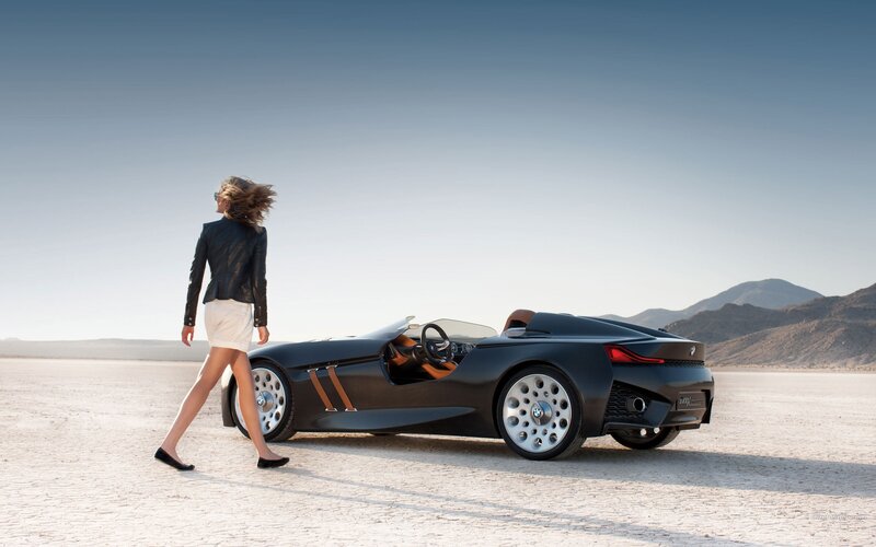 Woman walking near concept car