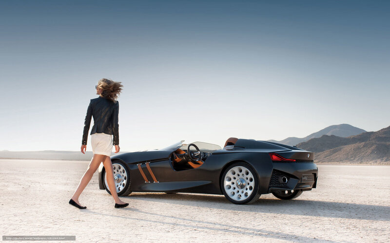 Woman walking near concept car