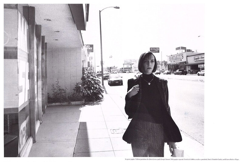 Woman walking on a city sidewalk