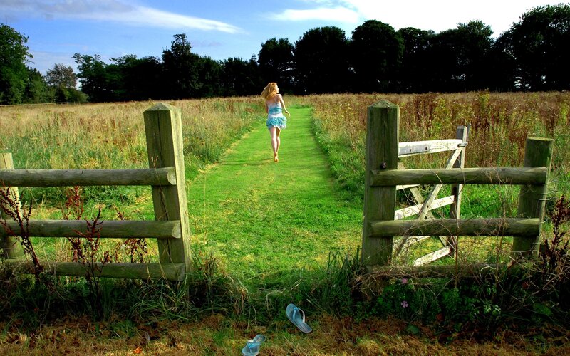 Woman walking on a country path